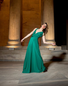 Our model in the Calypso Polymorphic Maxi Dress, in the Emerald Green shade from the front once again