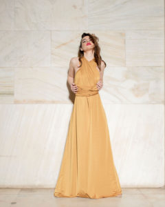 Our model in the Calypso Polymorphic Maxi Dress, in the Yellow Mustard shade from the front once again