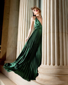 Our model in the Frances Stevens Grecian Pleated Dress, in the Emerald Green shade from the front